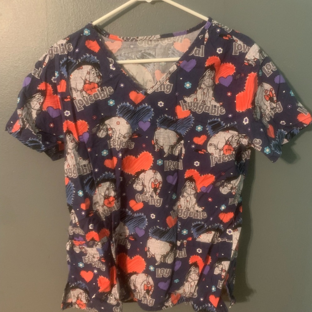 Scrub Top. Short sleeve. Eeore character. size large. 2 front pockets.